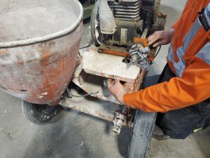 Worker Performing Peristaltic/Squeeze Pump Diagnostics